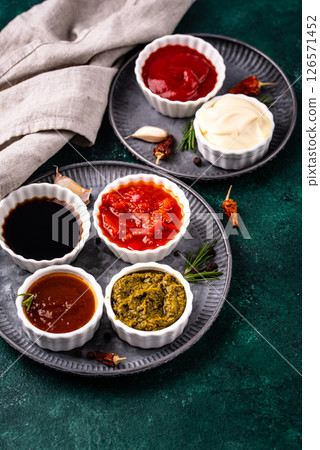 Set of different sauces. Ketchup, mustard, pesto Set of different sauces. Ketchup, mustard, pesto 126571452