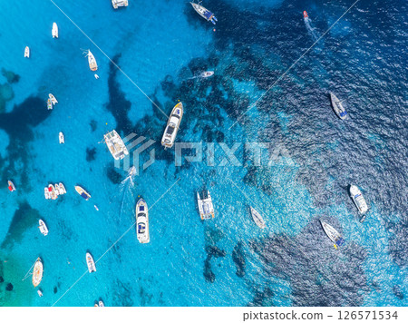 Drone view of a motor boats and yacht. Luxury transportation. Vacationing people. Drone view of a motor boats and yacht. Luxury transportation. Vacationing people. 126571534