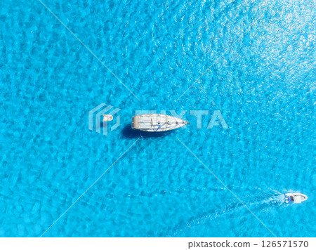 Summertime vacation. Sailing yacht at sea. Drone view on the yacht. Summertime vacation. Sailing yacht at sea. Drone view on the yacht. 126571570