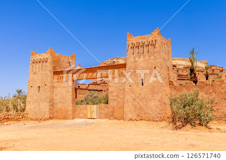 Ancient Ait Benhaddou ksar village gates with towers panorama, Ouarzazate province, Morocco Ancient Ait Benhaddou ksar village gates with towers panorama, Ouarzazate province, Morocco 126571740