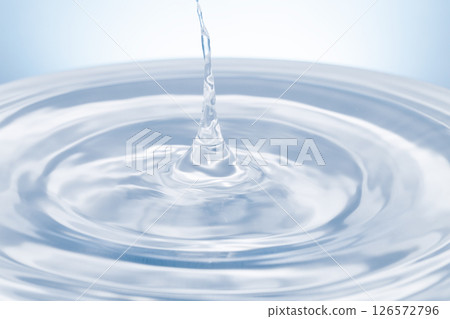 Drops of water falling on the surface of the water. 126572796