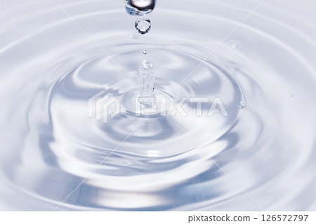 Drops of water falling on the surface of the water. Drops of water falling on the surface of the water. 126572797