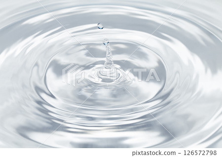 Drops of water falling on the surface of the water. 126572798