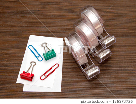 Paper clips and tape dispenser office stationery 126573726