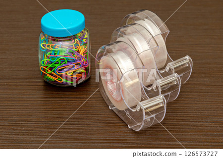 Paper clips plus tape dispensers stationary 126573727