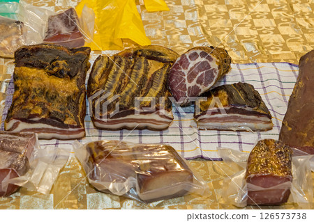 Homemade cured bacon on local market Homemade cured bacon on local market 126573738