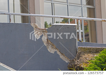 Cracked stone wall outside building Cracked stone wall outside building 126573757