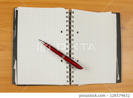 Open notebook with pen 126574632