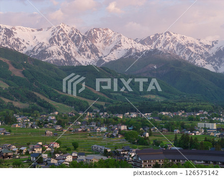 Early morning Hakuba Sanzan and fresh greenery in Hakuba Village, Nagano Prefecture (aerial shot by drone) 126575142