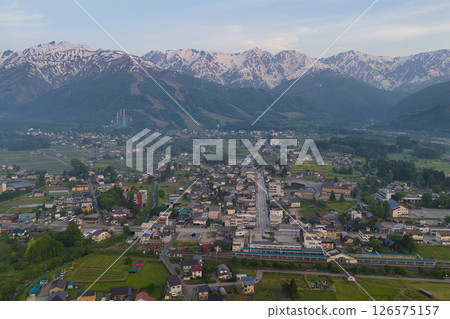Early morning Hakuba mountain range and fresh greenery in Hakuba Village, Nagano Prefecture (aerial shot by drone) 126575157