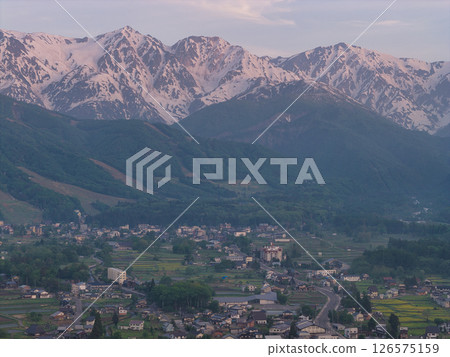 Early morning Hakuba Sanzan and fresh greenery in Hakuba Village, Nagano Prefecture (aerial shot by drone) 126575159