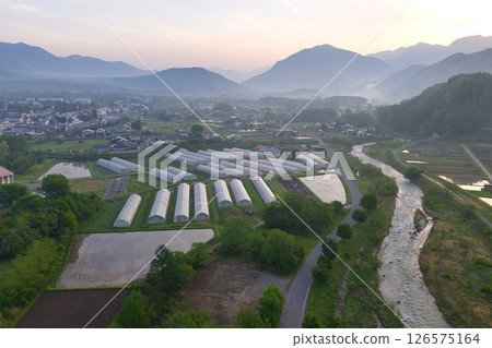 Hakuba Village in the early morning mist, Nagano Prefecture (aerial shot by drone) 126575164