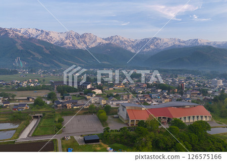 Hakuba Sanzan and Wing 21 in the early morning Hakuba Village, Nagano Prefecture (aerial shot by drone) 126575166