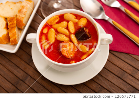 Tasty stew of asturian beans in gravy with sausages Tasty stew of asturian beans in gravy with sausages 126575771