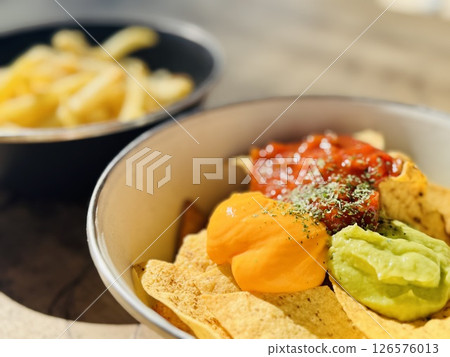 Enjoying Guacamole Outdoors 126576013