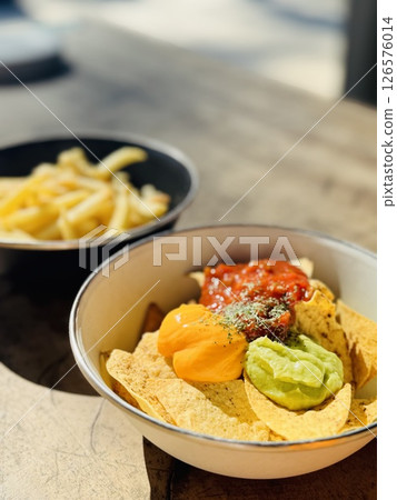 Enjoying Guacamole Outdoors 126576014