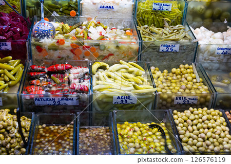 Pickled vegetables and olives on Turkish bazaar counter 126576119