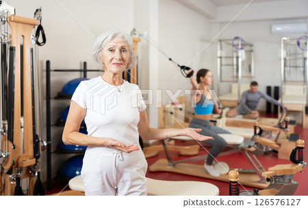 Elderly woman posing in pilates studio 126576127