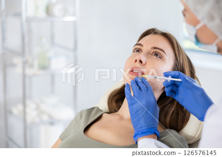 Facial injection young patient, closeup 126576145