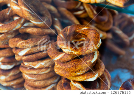 Freshly baked Turkish bagels simits on display case Freshly baked Turkish bagels simits on display case 126576155