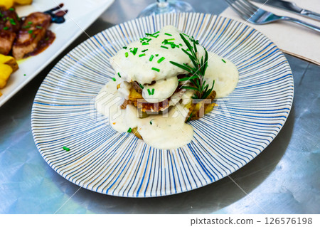 Dish of pork with Roquefort cheese sauce with potatoes Dish of pork with Roquefort cheese sauce with potatoes 126576198