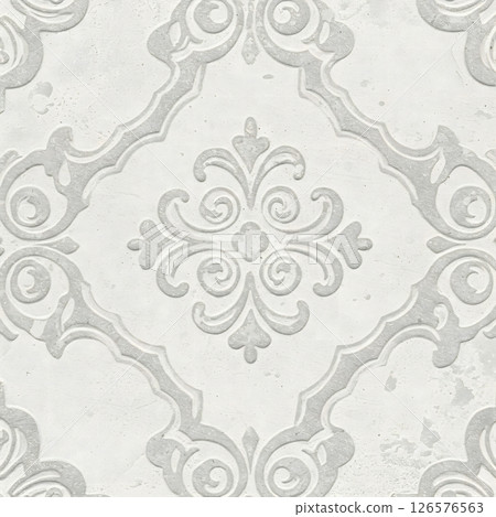 A light gray surface features a repeating ornate raised pattern with floral and scroll elements 126576563