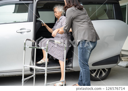 Asian senior woman patient sitting on walker prepare get to her car, healthy strong medical concept. Asian senior woman patient sitting on walker prepare get to her car, healthy strong medical concept. 126576714