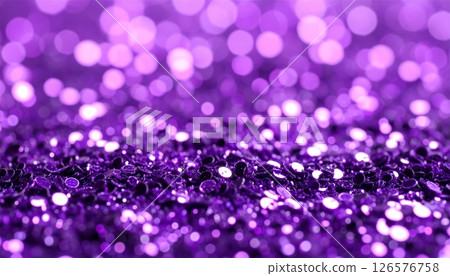 Bright glowing purple and pink Christmas bokeh circles sparkle on an abstract, festive holiday background 126576758