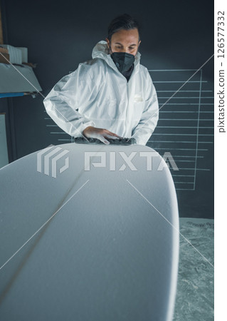 Shaper working on surf board 126577332
