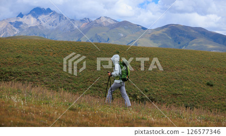 Woman hiking on high altitude mountain top Woman hiking on high altitude mountain top 126577346