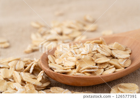 Oatmeal on a spoon (rolled oats) 126577391