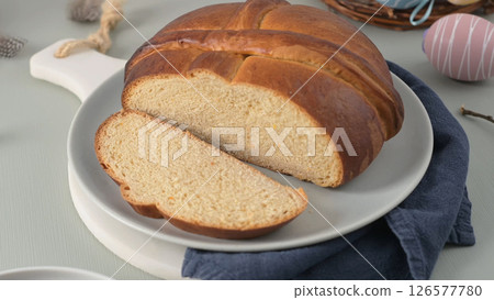 Traditional Portuguese folar on a plate with Easter decorations 126577780