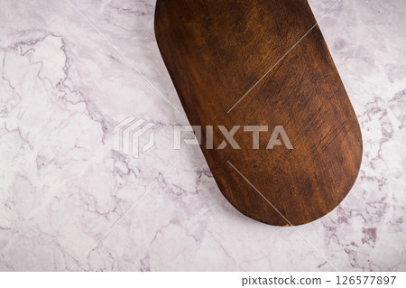 Wooden cutting board on a gray marble background 126577897