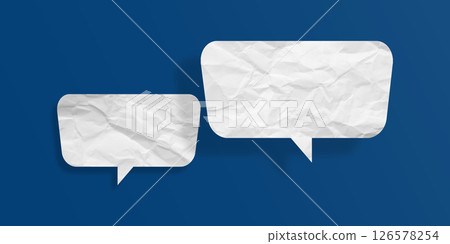 White speech bubble crumpled paper isolated on blue background White speech bubble crumpled paper isolated on blue background 126578254