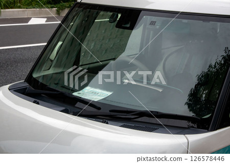 Cars parked with a disabled person's exemption sign displayed Cars parked with a disabled person's exemption sign displayed 126578446