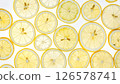 A refreshing background of lemon slices shining through the light 126578741