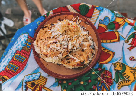 Top view of traditional pupusas on grill. Traditional grilled cheese pupusas 126579038