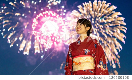 Image of a woman watching fireworks at a summer festival Background material Flyer, banner, video material AI-generated material 126580108