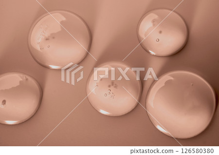 Cosmetic transparent gel drops in mocha mousse color Cosmetic transparent gel drops in mocha mousse color 126580380
