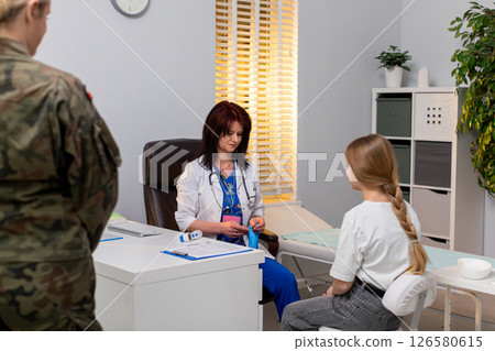 A Pediatric Consultation typically occurs in a Modern Medical Office focused on child wellbeing A Pediatric Consultation typically occurs in a Modern Medical Office focused on child wellbeing 126580615