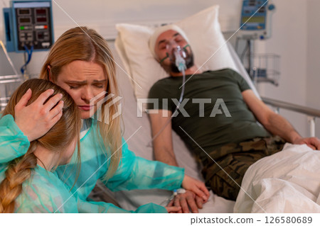 A heartfelt hospital scene highlights the vital family support in times of crisis and healing 126580689