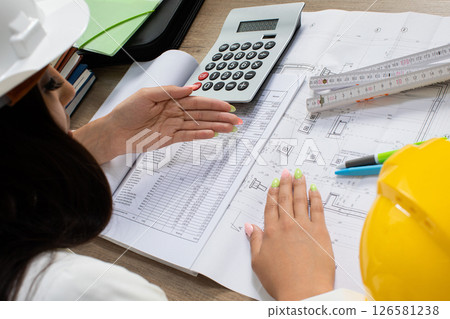 The Engineering Team is Collaborating on Detailed Project Plans and Calculations Effectively The Engineering Team is Collaborating on Detailed Project Plans and Calculations Effectively 126581238