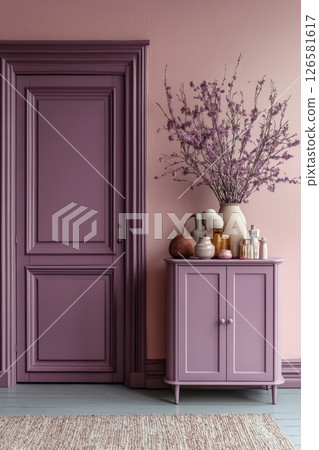 A purple room with a pink door and a pink cabinet 126581617