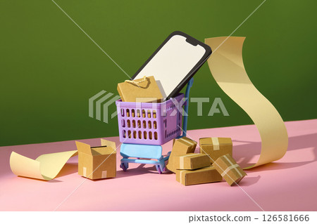 Side view of a paper cart and stacked boxes on a green and pink background with yellow paper rolls evoking logistics and retail operations. Creative paper cutting props, photo for advertising 126581666