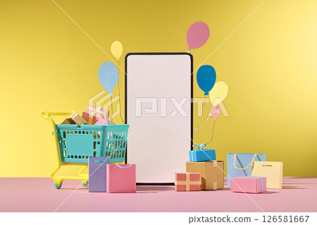 A large smart phone standing upright surrounded by shopping tools, set against a warm yellow background, symbolizes mobile commerce and convenience. The central white space of the design, the visual 126581667