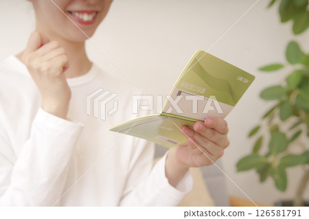 Japanese woman happy to have succeeded in saving money Japanese woman happy to have succeeded in saving money 126581791