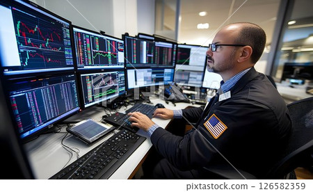 Stockbroker Analyzing Financial Data on Multiple Computer Screen 126582359