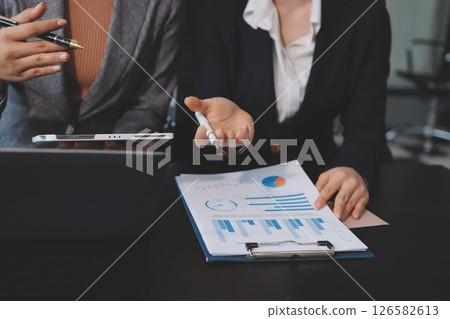 Accounting company provide finance and taxation planning for profitable cash flow, Auditor and accountant team working in office, analyze financial data and accounting record with calculator.Insight Accounting company provide finance and taxation planning for profitable cash flow, Auditor and accountant team working in office, analyze financial data and accounting record with calculator.Insight 126582613