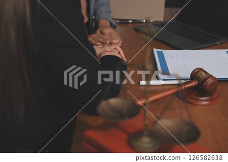 Judge gavel with Justice lawyers having team meeting at law firm background. Concepts of Law and Legal services. Judge gavel with Justice lawyers having team meeting at law firm background. Concepts of Law and Legal services. 126582638