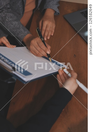 Judge gavel with Justice lawyers having team meeting at law firm background. Concepts of Law and Legal services. Judge gavel with Justice lawyers having team meeting at law firm background. Concepts of Law and Legal services. 126582649